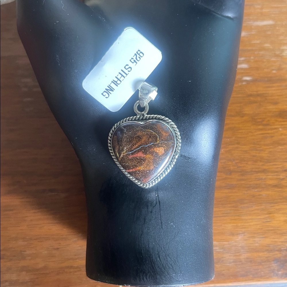 Boulder Opal heart shaped pendant set in sterling silver 
925